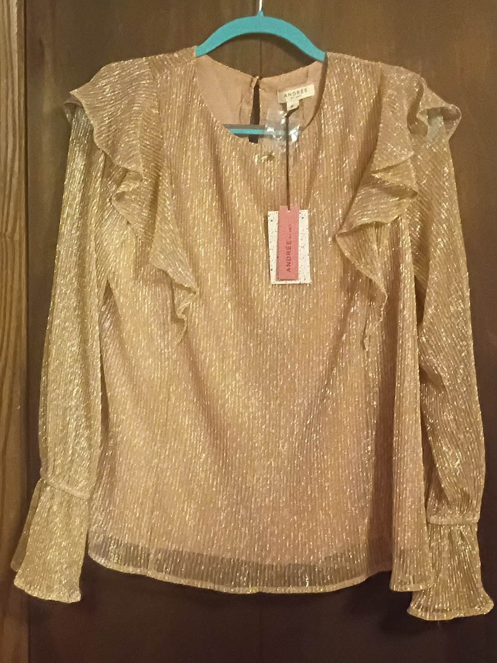 Blush Iridescent Ruffle Blouse by the boutique fashion brand Andrée by Unit